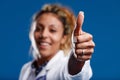 Thumbs-up close-up, competent brown-skinned doctor Royalty Free Stock Photo