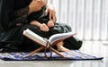 Focus to scripture book for muslim praying with blur background of mother and little sick child. Hope, Religion Concept