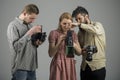 Focus on what matters. Paparazzi or photojournalists with vintage old cameras. Group of photographers with retro cameras