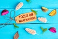 Focus on what matters text on paper tag