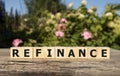 Focus on wooden blocks with letters Refinance text. Concept image Royalty Free Stock Photo