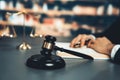 Focus wooden gavel hammer on blur background. Equilibrium