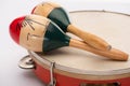 Focus of wooden maracas on tambourine