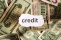 Focus on the word CREDIT on piece of torn white paper with blur Royalty Free Stock Photo