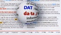 Focus on word data by magnifying a glass globe Royalty Free Stock Photo