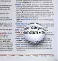 Focus on word data by magnifying a glass globe Royalty Free Stock Photo