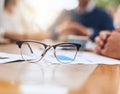 Focus on your vision. a pair of reading glasses on a table in the office. Royalty Free Stock Photo