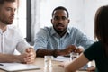 Focused African American HR manager talking to job candidate Royalty Free Stock Photo