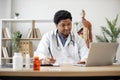 Physician typing on laptop and making notes in clinic Royalty Free Stock Photo