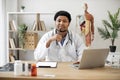 Physician typing on laptop and making notes in clinic Royalty Free Stock Photo