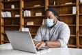 Focused African-American student in face mask