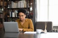 Focused Afro American business woman working at laptop at home Royalty Free Stock Photo