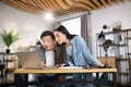 Focused asian man and woman using laptop at creative office Royalty Free Stock Photo