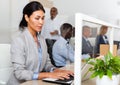 Focused asian woman entrepreneur working with laptop in office Royalty Free Stock Photo