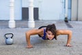 Focused athletic woman doing push-ups Royalty Free Stock Photo