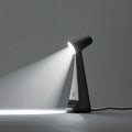 Focused Beam of Light from a Modern Desk Lamp Royalty Free Stock Photo