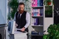 focused bearded businessman photocopying documents on