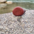 focused brown stones laid on the river bank, partially blurred