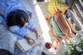 Focused brunette woman thinking imagination with notepad at nature summer outdoor village terrace