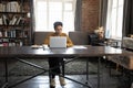 Focused business woman in home office full length candid portrait