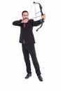 Focused businessman shooting a bow and arrow Royalty Free Stock Photo