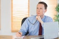 Focused businessman sitting at his desk Royalty Free Stock Photo