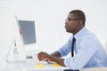 Focused businessman sitting at his desk working Royalty Free Stock Photo