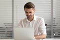 Focused businessman using laptop, busy employee working on project Royalty Free Stock Photo