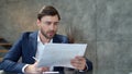 Focused businessman working with documents in office. Business man making notes Royalty Free Stock Photo