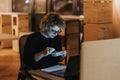 Experienced, businesswoman working late eating takeout at desk in office. Royalty Free Stock Photo