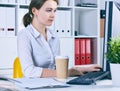 Focused businesswoman working at desk in creative office