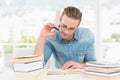 Focused casual businessman studying at his desk