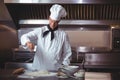 Focused chef preparing a cake