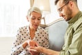 Focused client listening to a senior fortune-teller