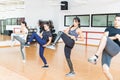 Focused Clients Doing Kickboxing Exercise In Health Club Royalty Free Stock Photo