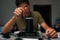 Focused computer technician male installing CPU cooler on motherboard with screwdriver, conducting maintenance and Royalty Free Stock Photo