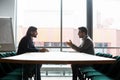 Focused confident young businessman making offer to partner. Royalty Free Stock Photo