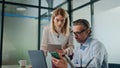 Focused coworkers discussing business at cabinet. Motivated team brainstorming Royalty Free Stock Photo