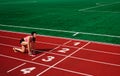 Focused determined motivated young athlete is getting ready to run a marathon at the Olympic Stadium. Royalty Free Stock Photo