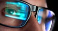 Developer coder looking on computer, programming code reflecting in glasses. Royalty Free Stock Photo