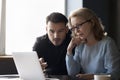 Focused employees, business man and woman talking at laptop Royalty Free Stock Photo