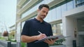 Focused director holding documents signing contract at office exterior closeup