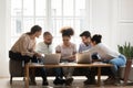 Focused diverse students working on research project together at home Royalty Free Stock Photo