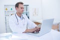 Focused doctor working with laptop Royalty Free Stock Photo