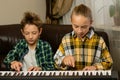 Focused Duo Piano Practice Royalty Free Stock Photo