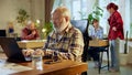 Focused elderly man of professionals engaged in discussing reports, reviewing charts, and making data-based decisions. Royalty Free Stock Photo