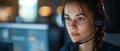 Focused Female Call Center Agent Diligently Handling Customer Service Tasks On A Computer