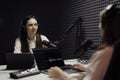 Focused Female Host Conducting Podcast Interview