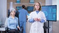 Focused female neuroscientist making rotation hand gesture