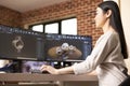 Asian developer analyzing 3D models on computer Royalty Free Stock Photo